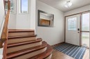 Entryway featuring a white door with decorative glass, a sidelight, and wood-finish flooring - 11139 157 Avenue Nw, Edmonton, AB  - Indoor Photo Showing Other Room 