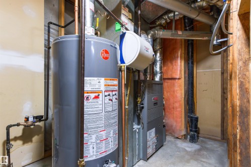 Water heater, furnace, and essential utility systems - 11139 157 Avenue Nw, Edmonton, AB - Indoor Photo Showing Basement