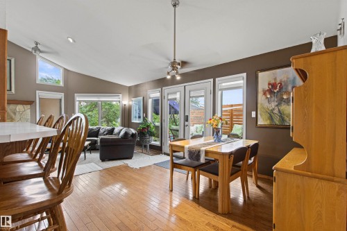 Vaulted ceiling and recessed lighting illuminate the open-concept living area - 11139 157 Avenue Nw, Edmonton, AB - Indoor Photo Showing Dining Room