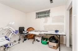Room featuring light-colored walls, a window with horizontal blinds, and a white ceiling - 