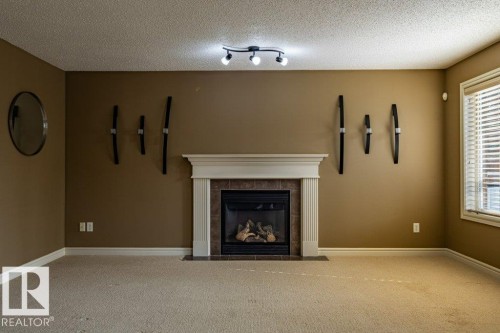 1115 117A Street Sw, Edmonton, AB - Indoor Photo Showing Living Room With Fireplace