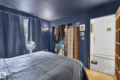 Wall-mounted sconce lighting - 351 Smith Crescent, Rural Parkland County, AB - Indoor Photo Showing Bedroom
