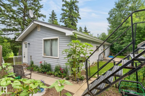 Light blue horizontal siding, white trim, and a white entry door - 351 Smith Crescent, Rural Parkland County, AB - Outdoor With Exterior