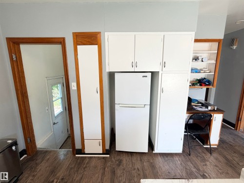 Wood-finish flooring - 10416 100 Avenue, Westlock, AB - Indoor Photo Showing Other Room