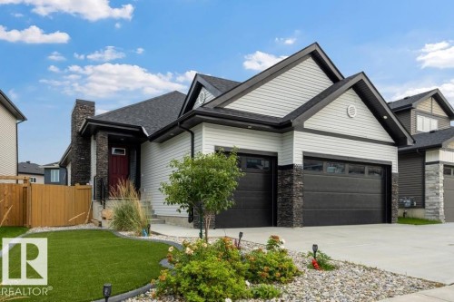 Contemporary exterior with light-toned siding and dark trim - 3303 Soleil Boulevard, Beaumont, AB - Outdoor