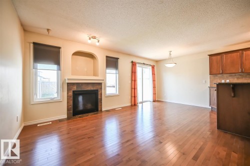 11425 14 Avenue Sw, Edmonton, AB - Indoor Photo Showing Living Room With Fireplace