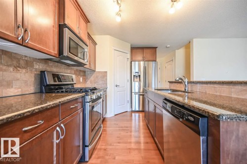 11425 14 Avenue Sw, Edmonton, AB - Indoor Photo Showing Kitchen With Stainless Steel Kitchen With Double Sink With Upgraded Kitchen