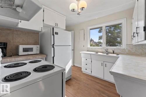 5105 58 Street, Cold Lake, AB - Indoor Photo Showing Kitchen With Double Sink