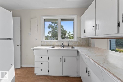 5105 58 Street, Cold Lake, AB - Indoor Photo Showing Kitchen With Double Sink