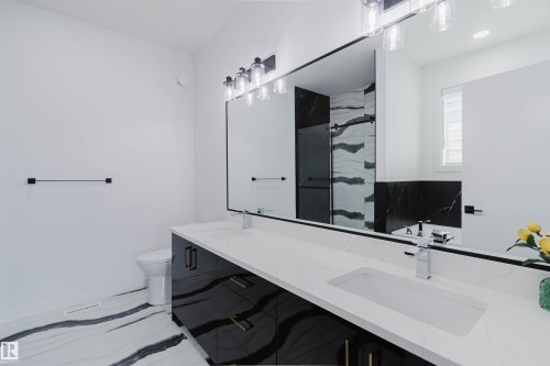 Dual vanity with integrated sinks and a white countertop - 5320 Kimball Place Sw, Edmonton, AB - Indoor