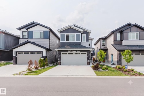 Contemporary two-story exterior with dark siding and white trim accents - 5320 Kimball Place Sw, Edmonton, AB - Outdoor With Facade