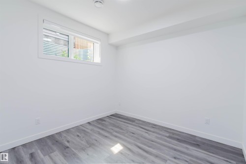 Recessed window with white blinds - 5320 Kimball Place Sw, Edmonton, AB - Indoor Photo Showing Other Room