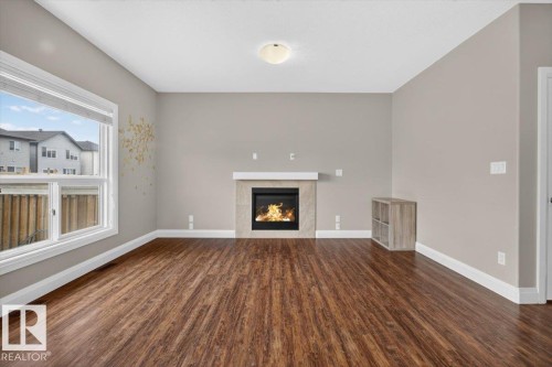 2005 15 Avenue Nw, Edmonton, AB - Indoor Photo Showing Living Room With Fireplace