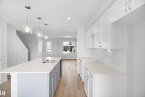 106 Juniper Wynd, Fort Saskatchewan, AB - Indoor Photo Showing Kitchen With Double Sink With Upgraded Kitchen