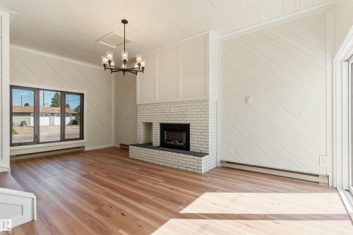 9328 168 Street Nw, Edmonton, AB - Indoor Photo Showing Living Room With Fireplace
