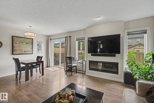 7 Peter Street, Spruce Grove, AB - Indoor Photo Showing Living Room With Fireplace
