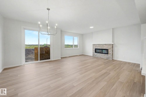 5435 Hawthorn Run Sw, Edmonton, AB - Indoor Photo Showing Living Room With Fireplace