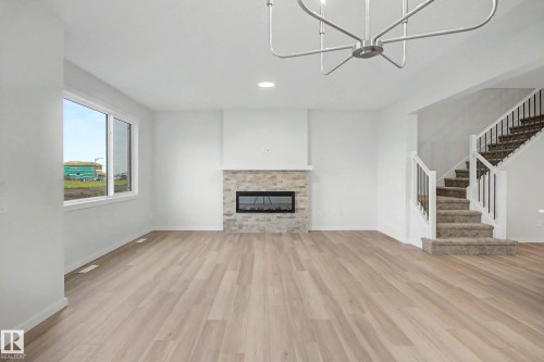 5435 Hawthorn Run Sw, Edmonton, AB - Indoor Photo Showing Living Room With Fireplace