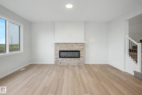 5435 Hawthorn Run Sw, Edmonton, AB - Indoor Photo Showing Living Room With Fireplace