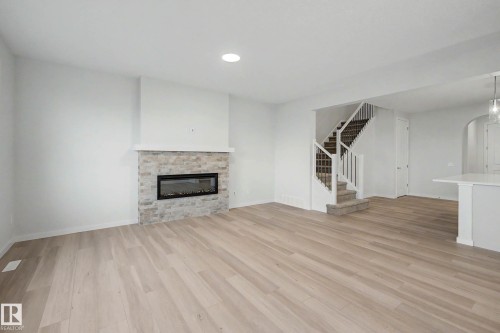 5435 Hawthorn Run Sw, Edmonton, AB - Indoor Photo Showing Living Room With Fireplace