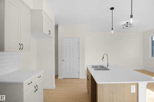 143 Ficus Way, Fort Saskatchewan, AB - Indoor Photo Showing Kitchen With Double Sink