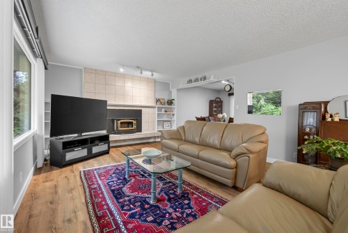 #6 25012 Sturgeon Rd, Rural Sturgeon County, AB - Indoor Photo Showing Living Room With Fireplace