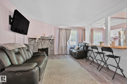 41 Akinsdale Gardens, St. Albert, AB - Indoor Photo Showing Living Room With Fireplace