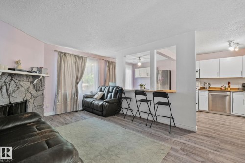 41 Akinsdale Gardens, St. Albert, AB - Indoor Photo Showing Living Room With Fireplace