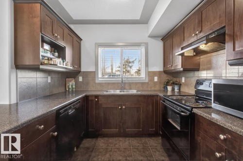 #101 4415 48 St, Leduc, AB - Indoor Photo Showing Kitchen With Double Sink