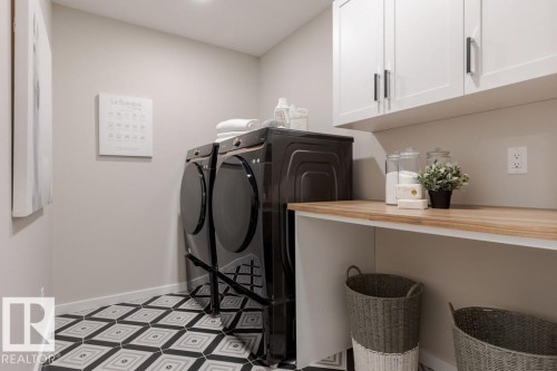 113 Stiles Bend, Leduc, AB - Indoor Photo Showing Laundry Room
