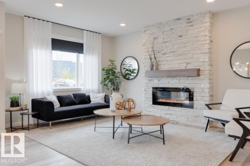 113 Stiles Bend, Leduc, AB - Indoor Photo Showing Living Room With Fireplace