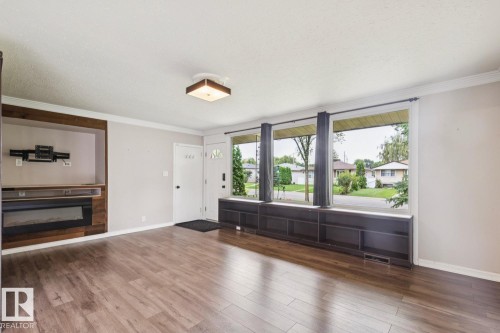 10151 71 Street Nw, Edmonton, AB - Indoor Photo Showing Living Room With Fireplace