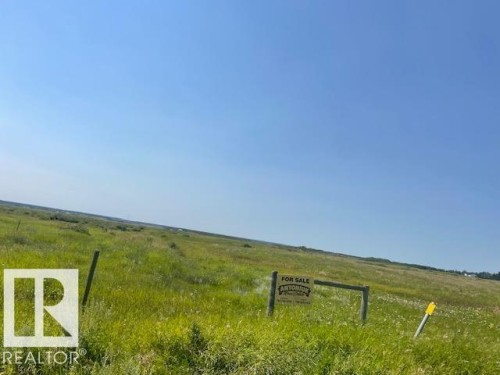 Expansive open land featuring natural grasses and distant foliage - Hwy 15 & Rr 185, Rural Lamont County, AB 