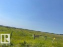 Expansive open land featuring natural grasses and distant foliage - Hwy 15 & Rr 185, Rural Lamont County, AB 