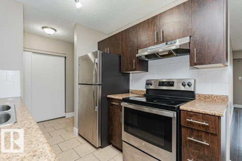 #209 14004 26 St Nw, Edmonton, AB - Indoor Photo Showing Kitchen With Stainless Steel Kitchen