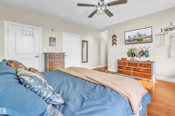 Warm interior space featuring wood-finish flooring - 
