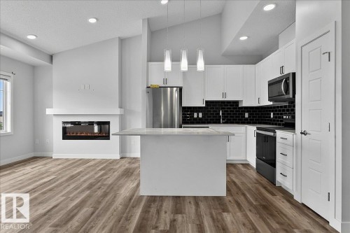 #3 2905 141 St Sw, Edmonton, AB - Indoor Photo Showing Kitchen With Fireplace With Stainless Steel Kitchen With Upgraded Kitchen