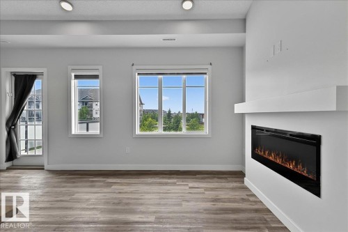#3 2905 141 St Sw, Edmonton, AB - Indoor Photo Showing Living Room With Fireplace