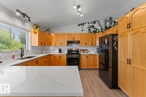 1004 12 Street, Cold Lake, AB - Indoor Photo Showing Kitchen With Double Sink