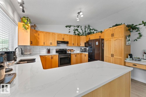 1004 12 Street, Cold Lake, AB - Indoor Photo Showing Kitchen With Double Sink
