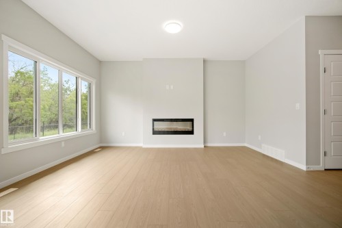 17731 7 Street Ne, Edmonton, AB - Indoor Photo Showing Living Room With Fireplace