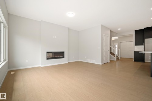 17731 7 Street Ne, Edmonton, AB - Indoor Photo Showing Living Room With Fireplace