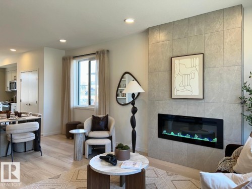 304 32 Street Sw, Edmonton, AB - Indoor Photo Showing Living Room With Fireplace