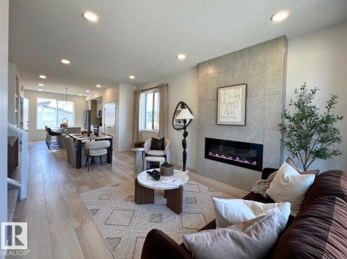 304 32 Street Sw, Edmonton, AB - Indoor Photo Showing Living Room With Fireplace
