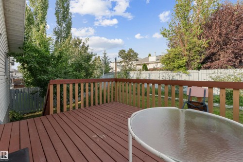 Expansive wood deck with railing and visible yard space - 1055 Jones Crescent Nw, Edmonton, AB - Outdoor