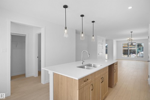 546 Ashgrove Circle, Leduc, AB - Indoor Photo Showing Kitchen With Double Sink