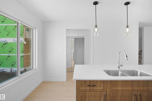 546 Ashgrove Circle, Leduc, AB - Indoor Photo Showing Kitchen With Double Sink