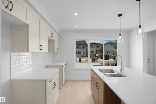 546 Ashgrove Circle, Leduc, AB - Indoor Photo Showing Kitchen With Double Sink With Upgraded Kitchen