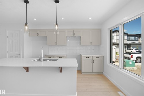 546 Ashgrove Circle, Leduc, AB - Indoor Photo Showing Kitchen With Double Sink
