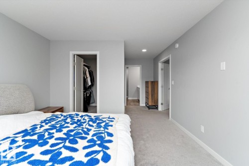 Soft grey walls with recessed lighting and neutral carpeting - 3241 Kulay Way Sw, Edmonton, AB - Indoor Photo Showing Bedroom